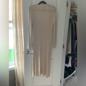 Light silky champagne, colored long cardigan. Late spot above pocket.